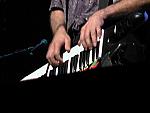 Closeup of Eric playing keyboards